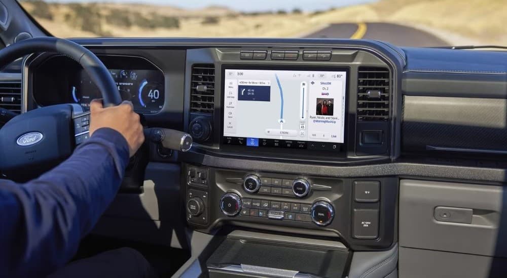 A close-up on the dashboard screen in the interior of a 2024 Ford F-250 is shown.