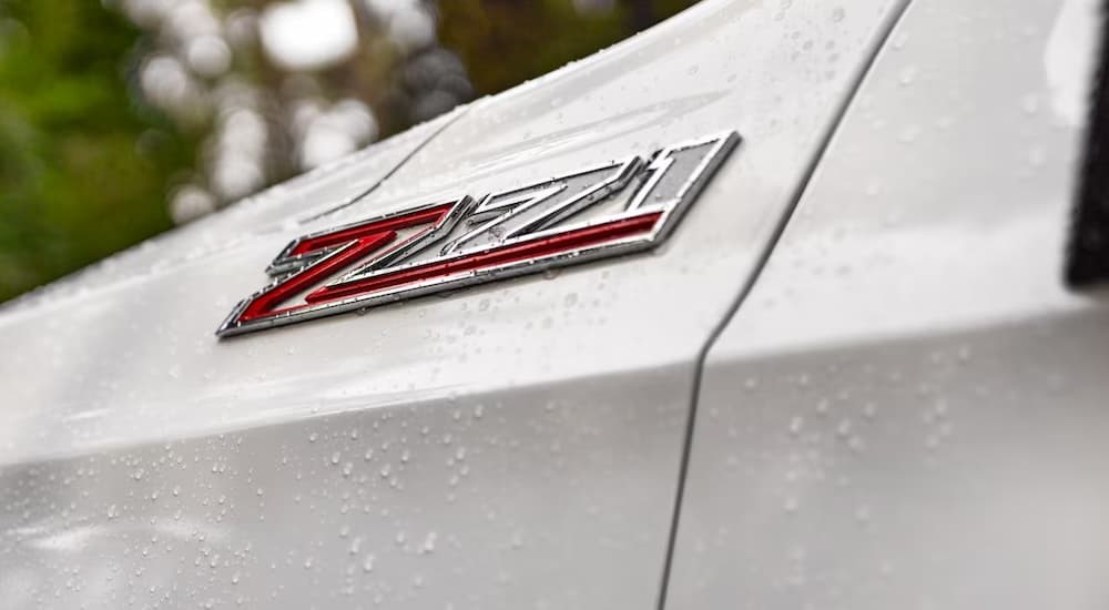 A close-up of the Z71 badge is shown on a white 2023 Chevy Tahoe Z71.