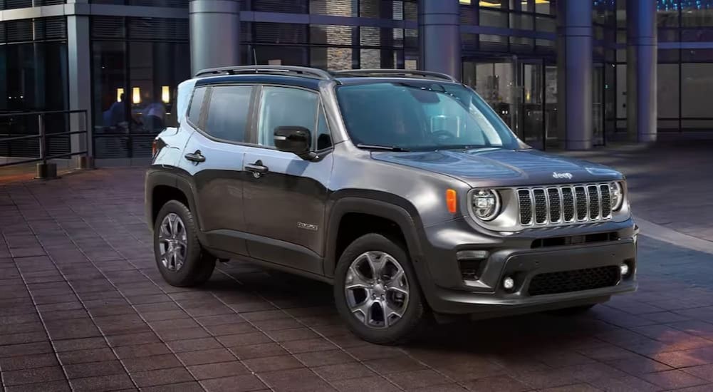 After searching for a "Jeep dealership near me", a gray 2023 Jeep Renegade, is shown parked near a mall.