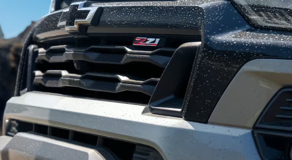 A close-up of the Z71 badge is shown on a white 2024 Chevy Colorado Z71.