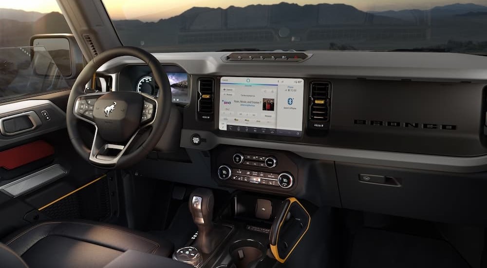 The black interior and dash of a 2024 Ford Bronco Sport is shown.