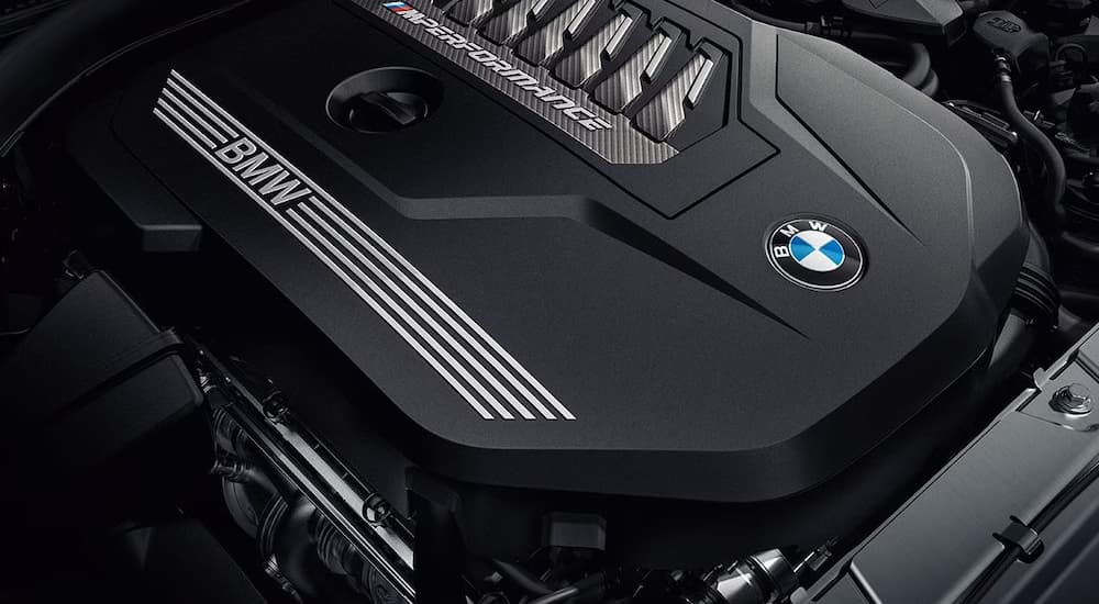The black M Performance engine of a 2024 BMW X3.