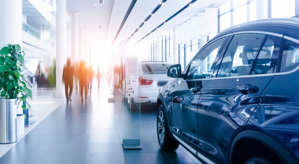 A bright and modern car dealership showroom.