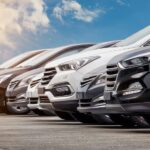 A lineup of CPO Chevys for sale on a sunny day.