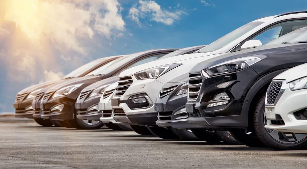 A lineup of CPO Chevys for sale on a sunny day.