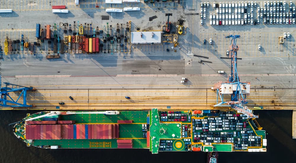 Overhead view of a roll-on/roll-off cargo ship unloading cars at the Port of Baltimore.