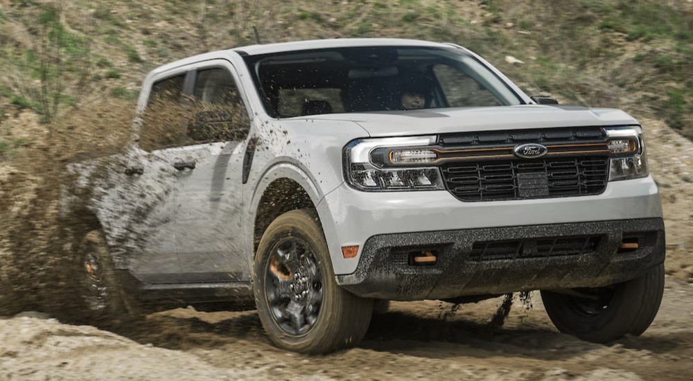 A gray 2024 Ford Maverick Tremor is shown driving off-road.