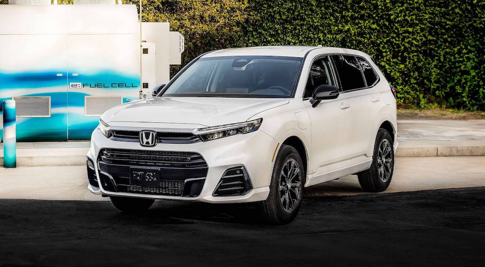 A white 2025 Honda CR-V e:FCEV parked on a curb.