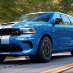 A blue 2024 Dodge Durango SRT driving.