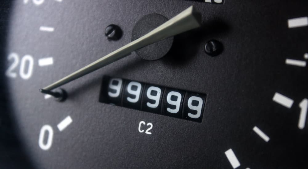 An odometer reading out 99,999 is shown.