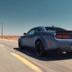 A blue 2023 Dodge Challenger RT is shown from the rear at an angle.