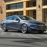 A grey 2019 Chevy Malibu is shown from the front at an angle.