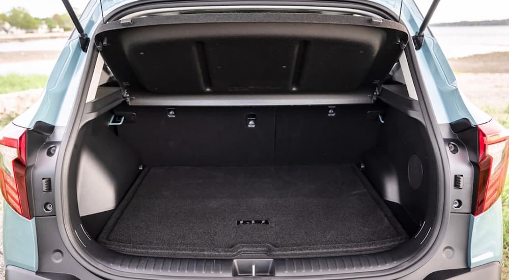The rear cargo space in a blue 2025 Kia Seltos for sale.