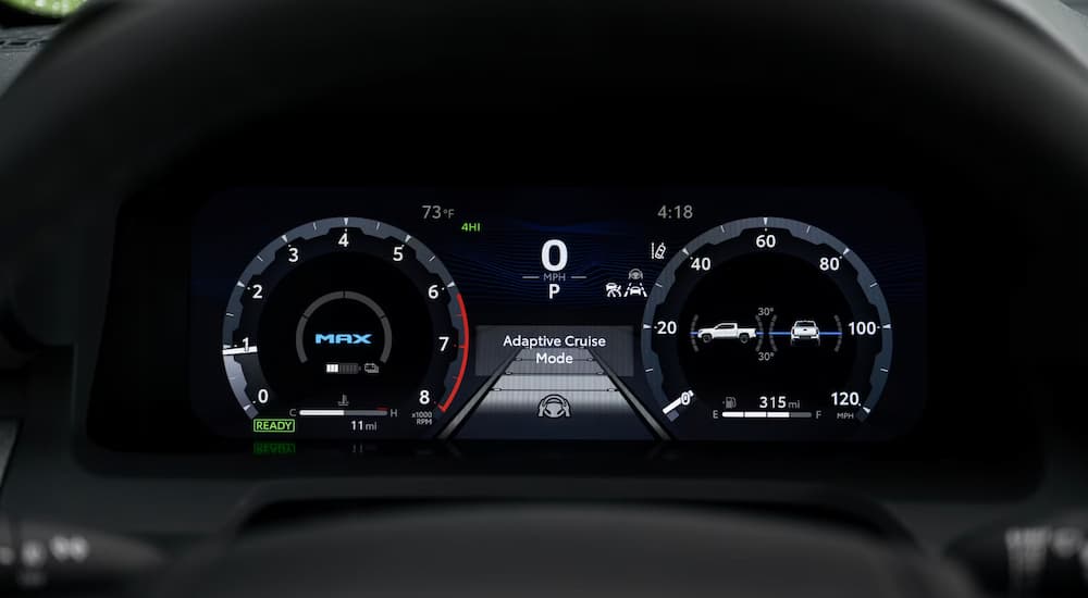 The digital cluster in a 2025 Toyota Tacoma for sale.