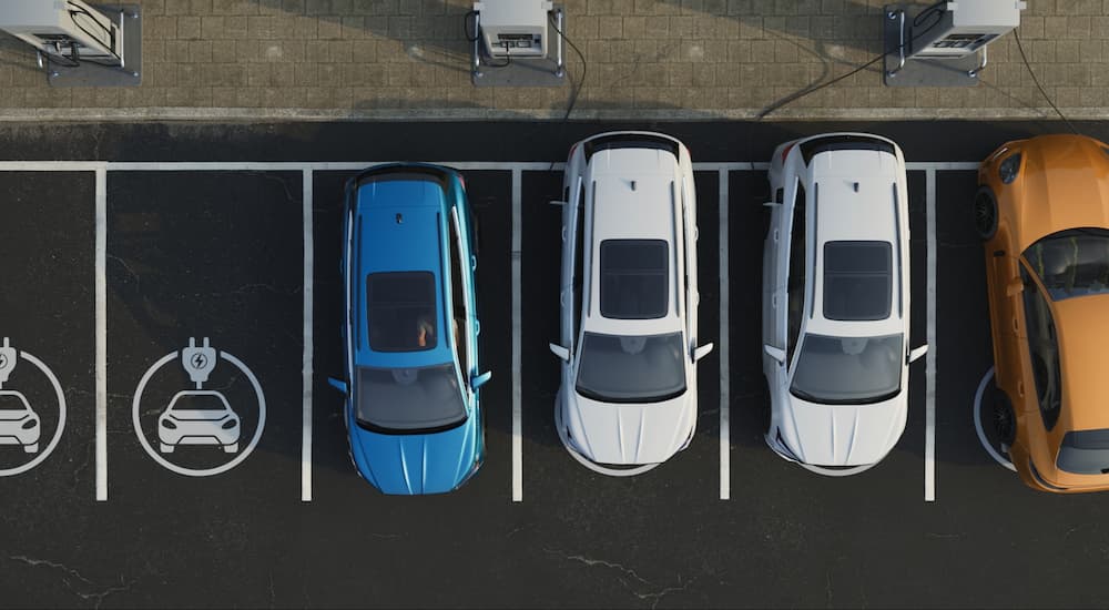 Top down view of electric vehicles are EV charging stations.