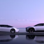 White Honda 0 Series Saloon and SUV facing each other.