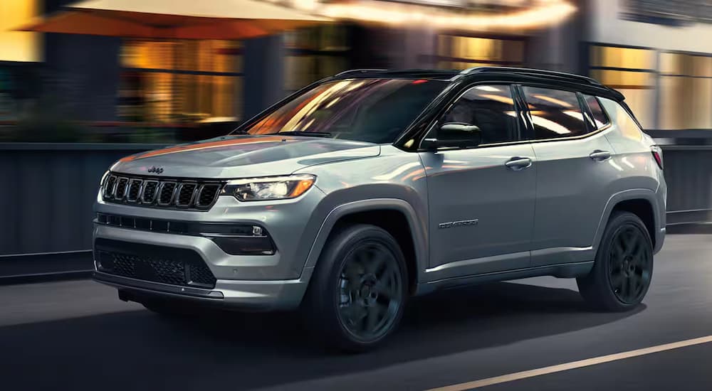 Gray 2025 Jeep Compass for sale driving in city
