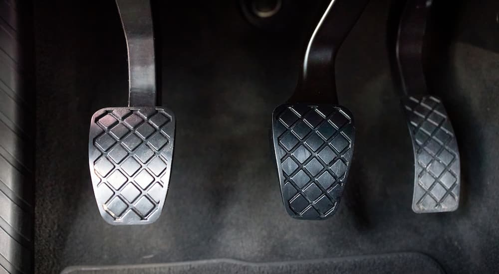 Close-up of the pedals on a car with a manual transmission