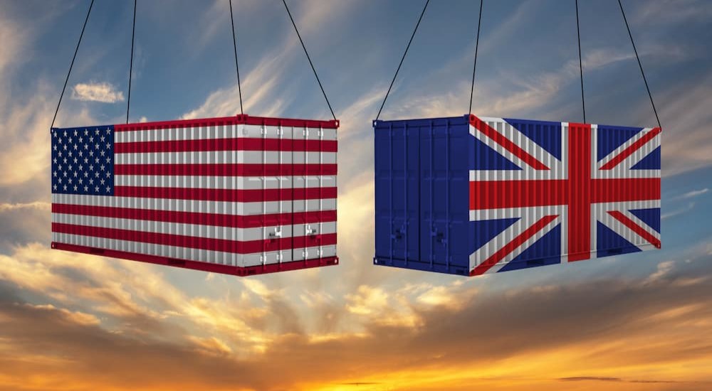 Two shipping container suspended by wires.
