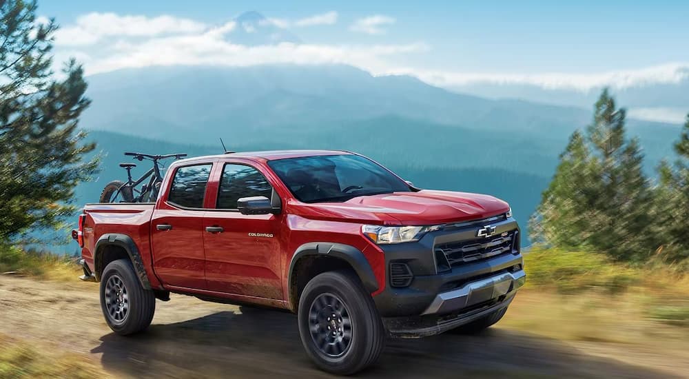 A red 2025 Chevy Colorado off-roading
