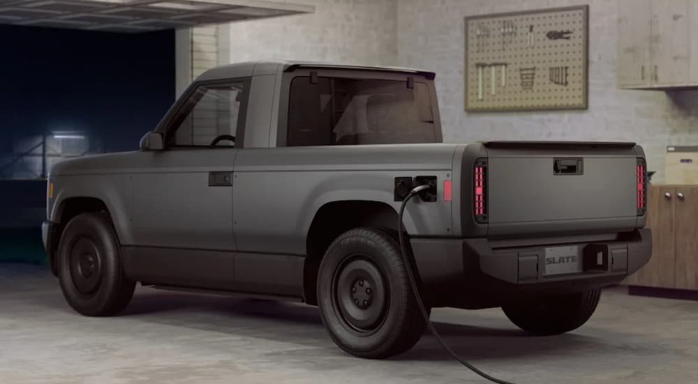 A gray Slate Truck charging in a garage.
