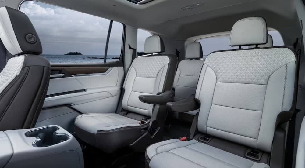 The black and white interior in a 2025 GMC Acadia AT4 for sale near New Albany.