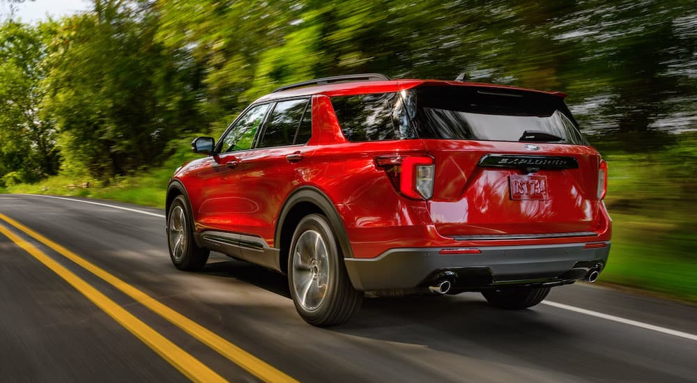 A red 2022 Ford Explorer from the rear at an angle.