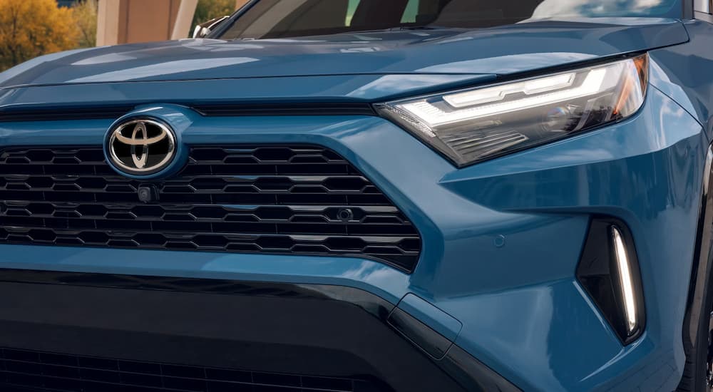 Front grille of a blue 2026 Toyota RAV4 for sale