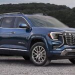 A blue 2026 GMC Terrain Denali parked after visiting a GMC dealer.