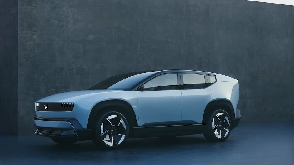 A white Honda 0 SUV parked in a building.