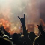 Hand raised showing a heavy metal rock sign, devil horns