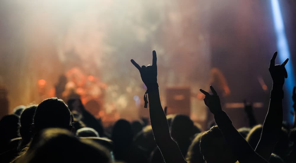Hand raised showing a heavy metal rock sign, devil horns