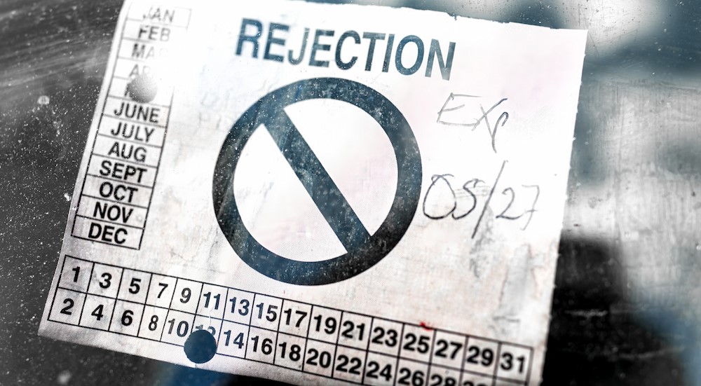 A rejection sticker on a windshield.