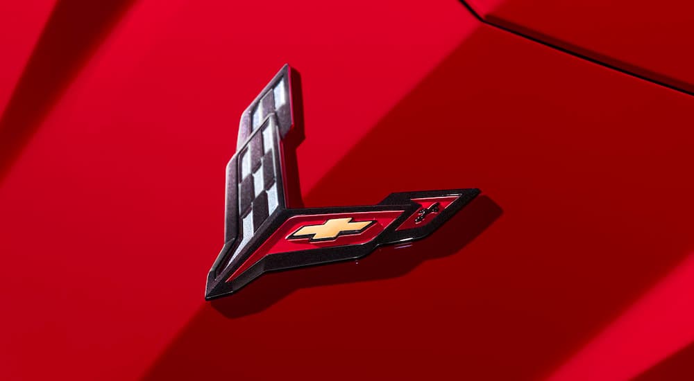 Close-up of the Chevy Corvette emblem on a red 2023 Chevy Corvette