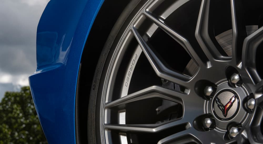 Close-up of the tire and rim on a blue 2023 Chevy Corvette Stingray Z06