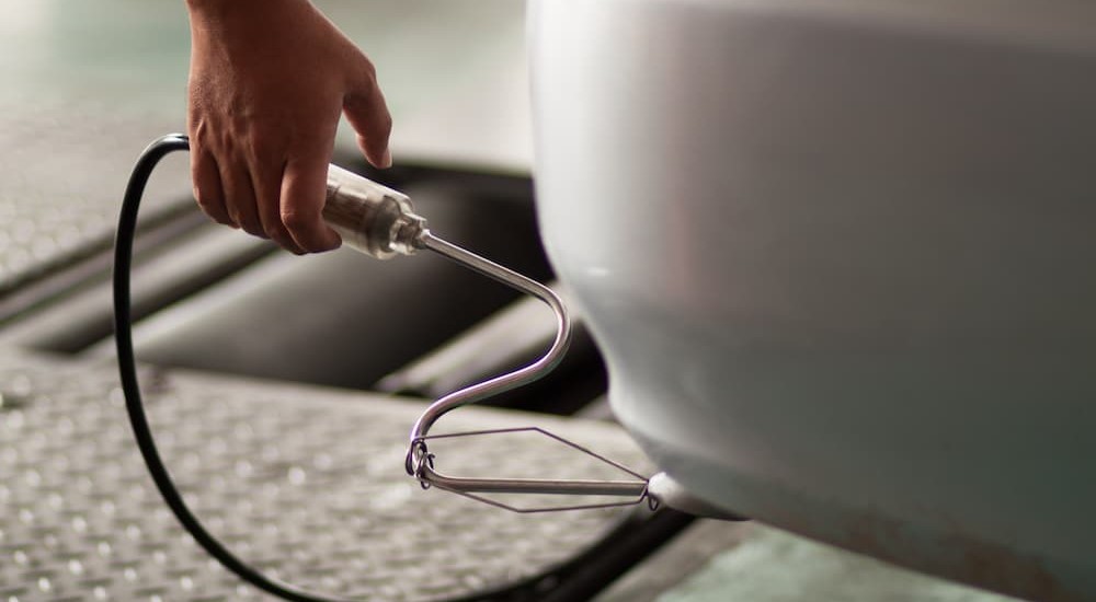 Emissions testing performed on a vehicle.
