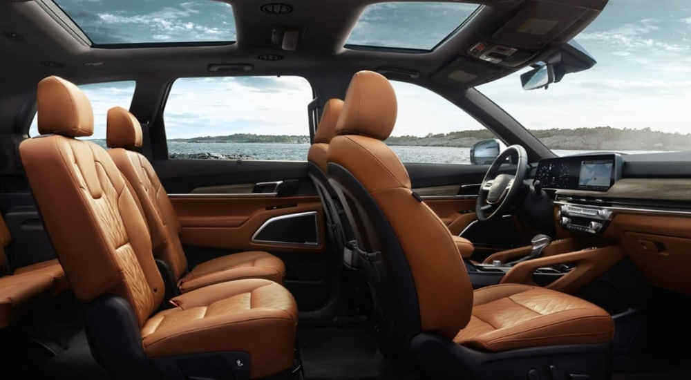 Side view of brown leather seats inside a 2024 Kia Telluride.