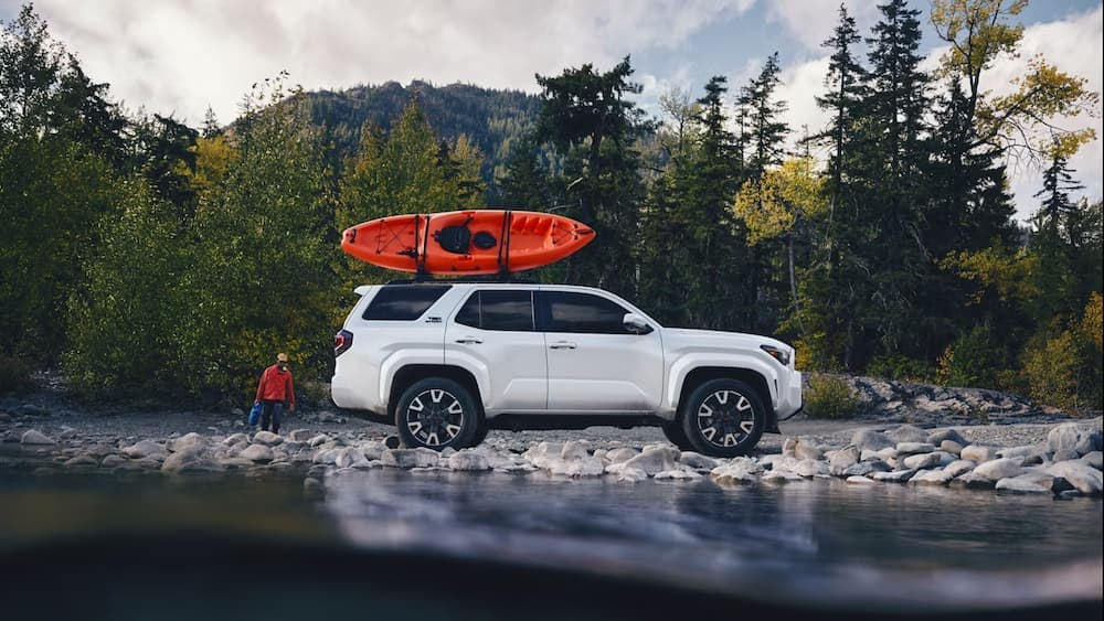 A white 2025 Toyota 4Runner TRD Sport Premium parked off-road.