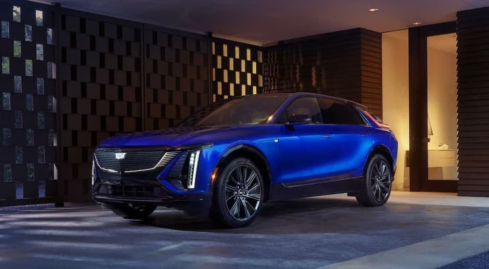 A blue 2025 Cadillac LYRIQ parked on a driveway.
