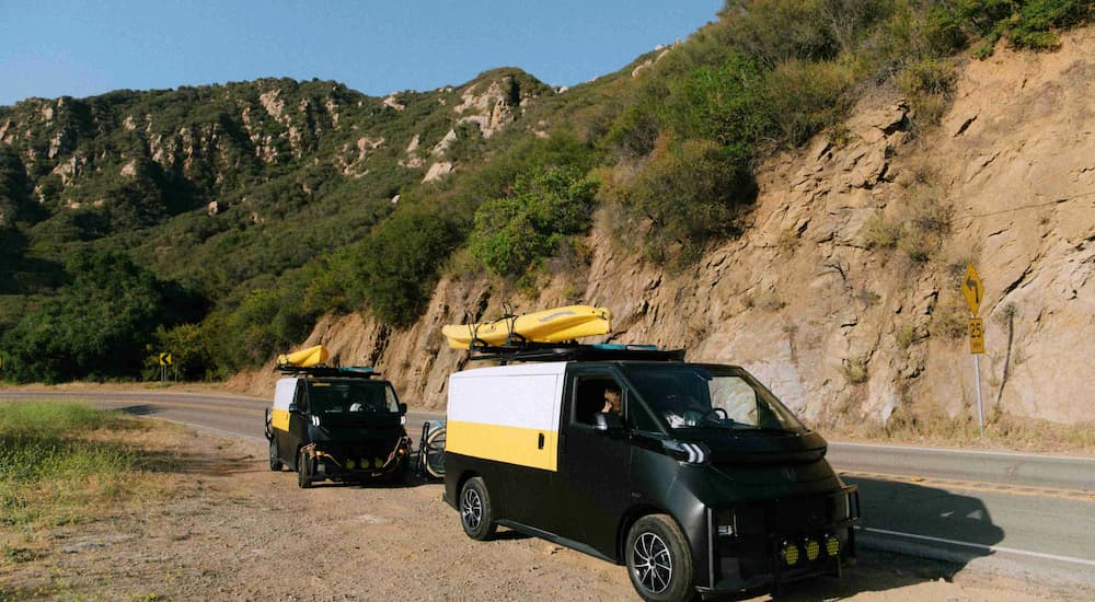 Two 2026 Olympian Motors Model 42 parked off-road