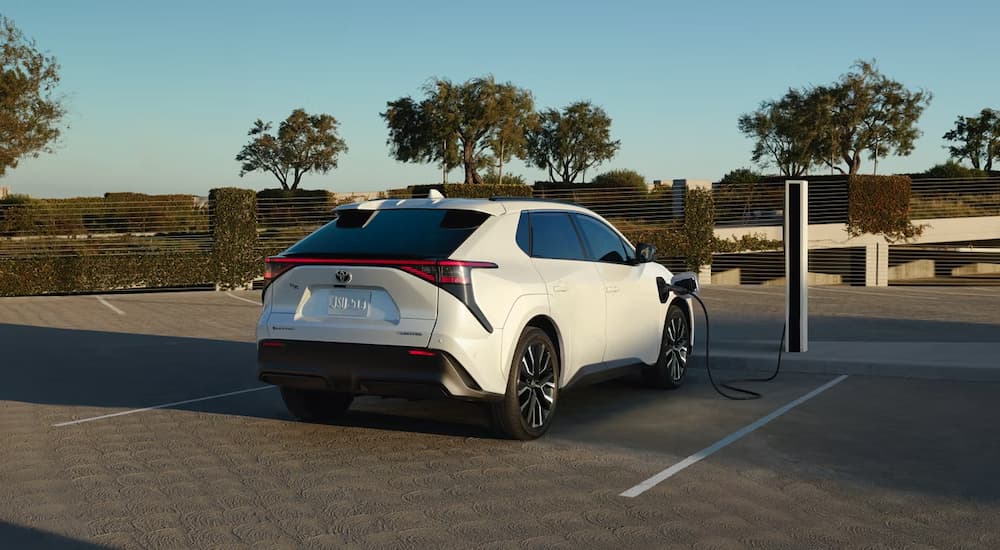 A white 2026 Toyota bZ parked charging
