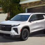A white 2025 Chevy Traverse parked on a driveway.