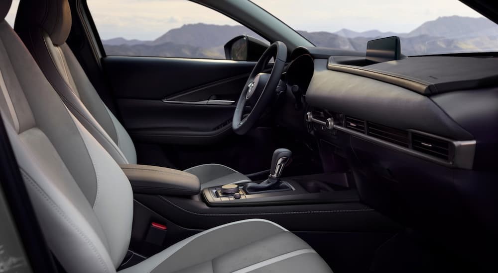 The gray and black interior and dash in a 2026 Mazda CX-30 for sale.