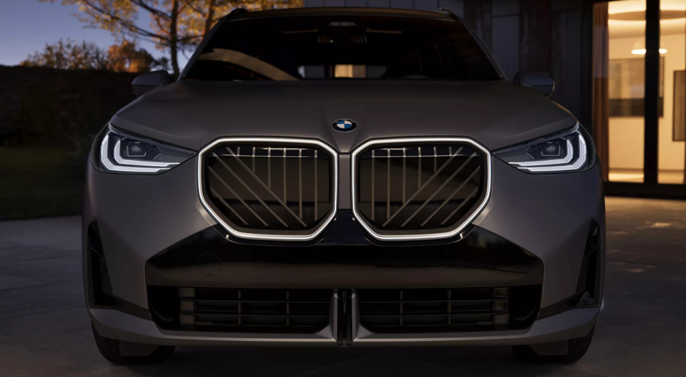 Close-up of the illuminated grille of a white 2026 BMW X3