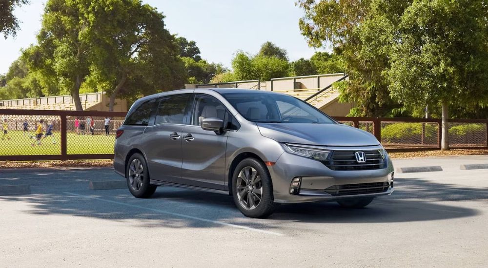 Grey 2024 Honda Odyssey Elite parked at a soccer field