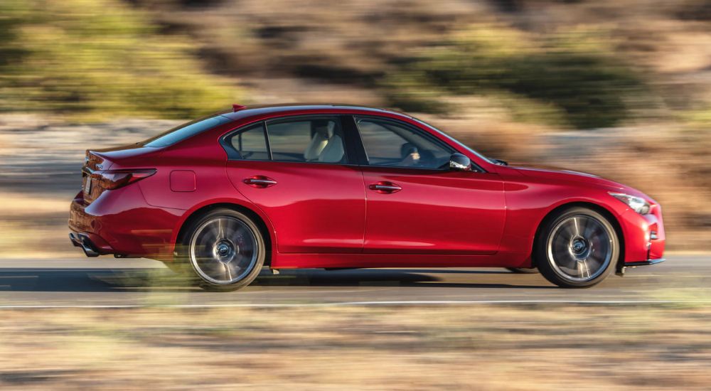 Red 2026 Infiniti Q50 speeding.