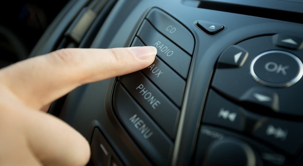 A person pressing the radio button.