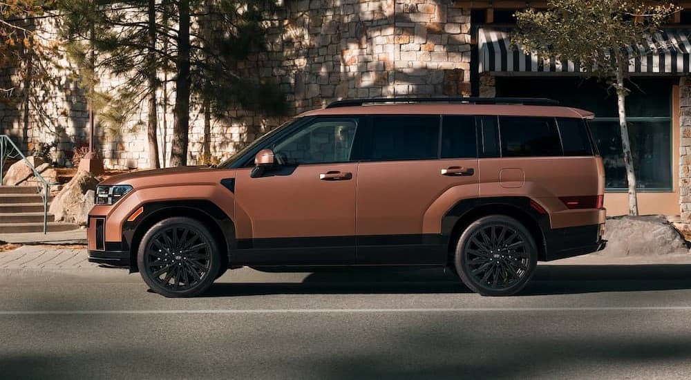 A copper 2025 Hyundai Santa Fe parked in a city.